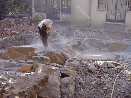 Dexpan Proyecto de excavacin y demolicin de rocas en el patio de una casa